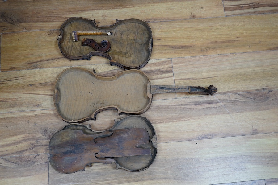 A quantity of violin parts and violins, a ukelele, a double bass scroll, a pinfold metronome, a violin case by Hill, a viola etc. Condition - for restoration